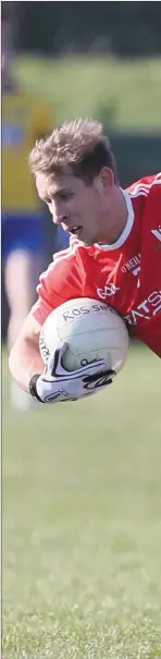  ??  ?? Louth’s Anthony Williams is knocked to