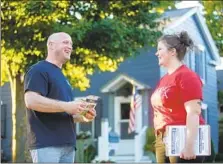  ??  ?? MAYOR Thom Dionne, left, of Utica, Mich., said Schuette’s Democratic rival has won over voters with her pledge to fix the roads.