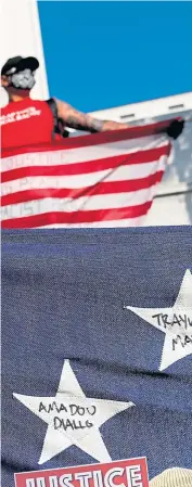  ?? ?? A protester holds a flag with the names of victims of police killings during a protest in Los Angeles in 2020. And, below, earlier this year students walk out of school in Saint Paul, Minnesota to demand justice for police shooting victim Amir Locke