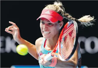  ?? VINCENT THIAN, THE ASSOCIATED PRESS ?? Angelique Kerber hits a forehand return to Victoria Azarenka during their quarter-final match at the Australian Open in Melbourne.