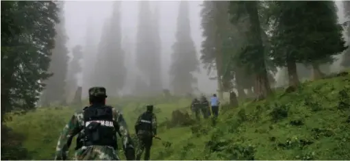  ??  ?? Ili detachment nt of Xinjiang forest orest division under nder China's armed rmed police forces during uring an anti-poaching ching operation. . The detachment ment shoulders s the responsibi­lity bility of protecting cting the ecological gical security...