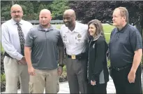  ??  ?? Retirees embrace each other while posing with Charles County Sheriff Troy Berry. Retirees were recognized for their years of service to the CCSO. From left, M/Cpl. Ronald Leukhardt, Cfc.Richard Allen, Berry, M/Sgt. Tracy Williams and Cfc. Roger Fallin.