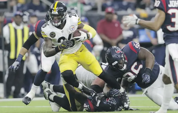  ?? PHOTOS: TIM WARNER/GETTY IMAGES ?? Le’Veon Bell finished with 69 yards and a touchdown as the Pittsburgh Steelers defeated the Houston Texans 34-6 Monday at NRG Stadium in Houston.