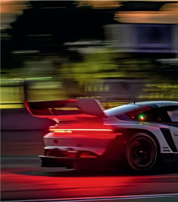  ?? ?? Record breaking: The 911 GT3 R rennsport is driven by Jörg Bergmeiste­r.
“I never drove so fast in Laguna Seca before!” said the delighted brand ambassador and former works driver following the first laps in the special model limited to 77 units.