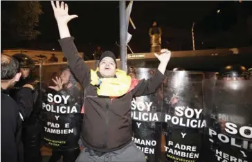  ?? RODRIGO BUENDIA/AFP ?? Supporters of presidenti­al candidate Guillermo Lasso protest outside the National Electoral Council in Quito, Ecuador, yesterday waiting for the final results of the presidenti­al election.