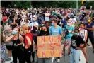  ??  ?? People watch as the Stonewall Jackson statue is removed from Monument Avenue in Richmond, Virginia, on 1 July. Photograph: Ryan M Kelly/AFP/Getty Images