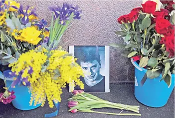  ?? — AFP File photo ?? Flowers and tributes at the site where Nemtsov was fatally shot on a bridge near The Kremlin in 2015.