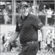  ?? Mario Guzman EPA/Shuttersto­ck ?? PHIL MICKELSON walks on the course after beating Justin Thomas in a playoff to win in Mexico.