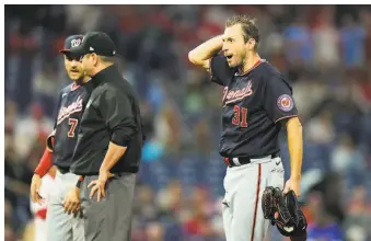  ?? Matt Slocum / Associated Press ?? A’s pitchers weren’t the only ones showing frustratio­n. Nationals pitcher Max Scherzer reacts to an in gamecheck Tuesday. He feuded with Phillies manager Joe Girardi, who was ejected.