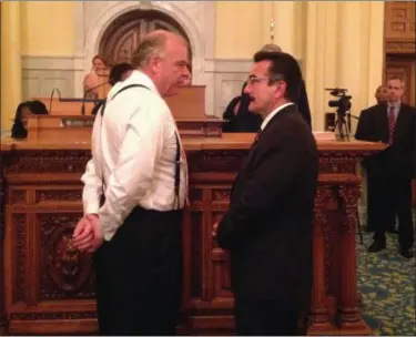  ?? MICHAEL CATALINI — THE ASSOCIATED PRESS ?? Democratic Senate President Steve Sweeney, left, and Democratic Assembly Speaker Vincent Prieto speak on the floor of the Assembly shortly before the deadline to pass a budget Friday in Trenton, N.J. Sweeney and Prieto are at odds over whether to...