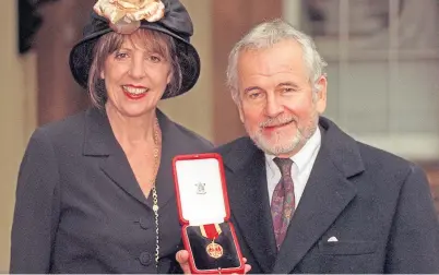  ??  ?? GIFTED: Sir Ian Holm, alongside his third wife Penelope Wilton, after he was knighted by the Queen in 1998