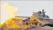  ??  ?? A frame grab from video provided by progovernm­ent Syrian Central Military Media shows a tank firing on militant positions.