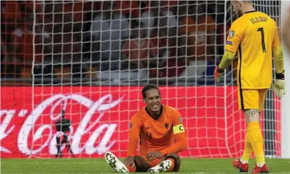  ??  ?? Virgil van Dijk is injured in stoppage-time of the Netherland­s’ 6-1 win over Turkey in Amsterdam. Photograph: Peter de Jong/AP
