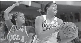  ?? Jessica Hill / The Associated Press ?? Connecticu­t’s Napheesa Collier (right) pulls down a rebound past UCLA’s Jordin Canada.