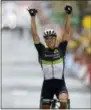  ?? PETER DEJONG — THE ASSOCIATED PRESS ?? Norway’s Edvald Boasson Hagen celebrates as he crosses the finish line to win the 19th stage of the Tour de France on Friday.