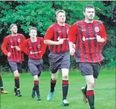  ?? Photograph: Scott Currie, BBC. ?? Players stand out in the crowd with their red and black strips.