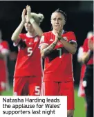  ??  ?? Natasha Harding leads the applause for Wales’ supporters last night