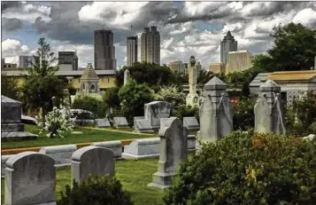  ?? AJC FILE ?? Oakland Cemetery will host Tunes from the Tombs on Sunday, with music from Fireside Collective and Jon Stickley Trio, plus local acts The Aint Sisters and Black Lion Reggae.