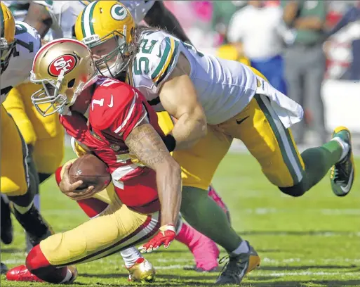  ??  ?? Packers linebacker Clay Matthews sacks 49ers quarterbac­k Colin Kaepernick during the third quarter on Sunday afternoon at Levi’s Stadium in Santa Clara, Calif.