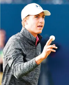  ??  ?? US golfer Jordan Spieth reacts to making a putt on the 18th green during his third round on day three of the Open Golf Championsh­ip at Royal Birkdale golf course near Southport in north west England on July 22, 2017. Jordan Spieth will take a...