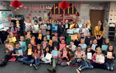  ?? ?? Students at Cascade Elementary School in the U.S. state of Utah show off their handmade Chinese New Year cards to Chinese President Xi Jinping on January 21, 2020