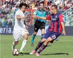  ??  ?? CROTONE: Crotone’s Noe Dussenne, right, challenges AC Milan’s Mati Fernandez during a Serie A soccer match, at the Ezio Scida stadium. — AP