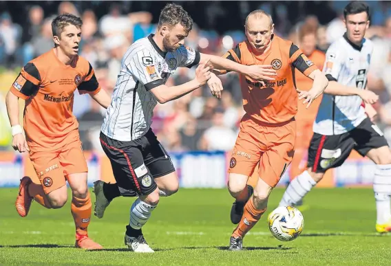  ??  ?? Rory Loy, seen here playing for St Mirren against Dundee United’s Willo Flood, can still have a future at Dens Park.