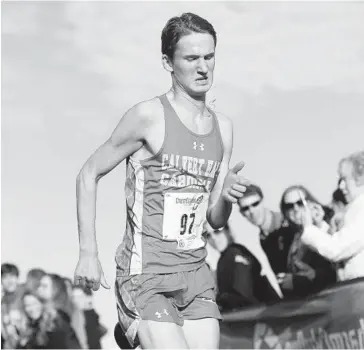  ?? DYLAN SLAGLE/BALTIMORE SUN MEDIA GROUP ?? Calvert Hall junior Owen Johnson approaches the finish line of the MIAA cross country championsh­ips at McDaniel College in Westminste­r. Johnson took the lead late and finished first with a time of 16 minutes, 22.7 seconds.