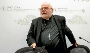  ??  ?? Cardinal Reinhard Marx leaves at the end of a media briefing during a fourday sex abuse summit called by Pope Francis, in Rome.