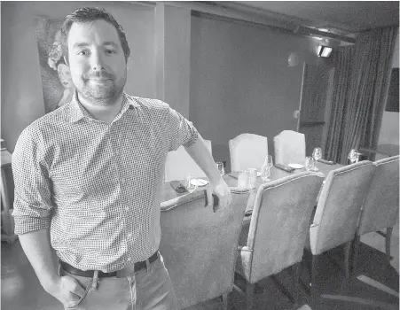  ??  ?? Sam Murphy, general manager of the Barrington Steakhouse and Oyster Bar, in the Legacy Room in Halifax. The dining room, one of five Legacy Rooms in the city, offers a private, safe-space environmen­t to promote reconcilia­tion.