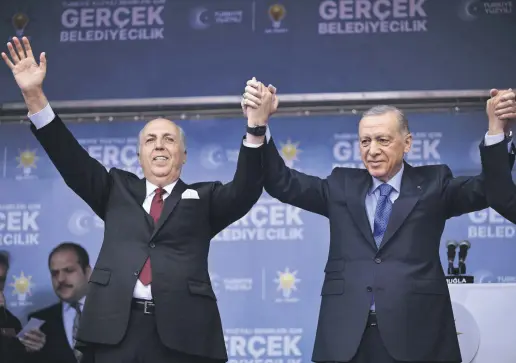  ?? ?? President Recep Tayyip Erdoğan (R) and Justice and Developmen­t Party mayoral candidate Aydın Ayaydın greet the crowd, Muğla, Türkiye, March 3, 2024.