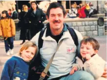  ??  ?? >
Former tennis and football reporter Mike Ward, who has died aged 65, with his children Olivia and Henry