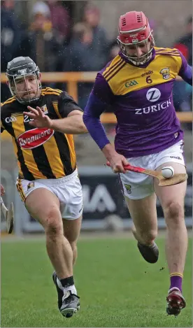  ??  ?? Centre-back Pádraig Foley soloing away from Kilkenny’s Richie Hogan.