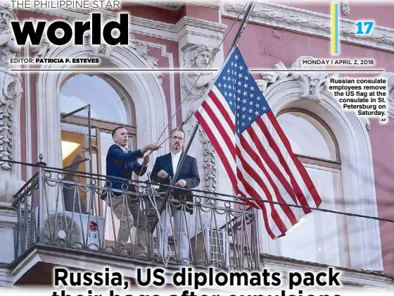  ??  ?? Russian consulate employees remove the US flag at the consulate in St. Petersburg on Saturday.