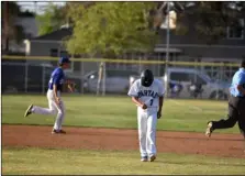  ?? PHOTO AARON BODUS ?? the Spartans’ Alex Monroy (7) walks off the field after being called out in the bottom of the eighth inning to end Central’s playoff game against West Hills on tuesday.