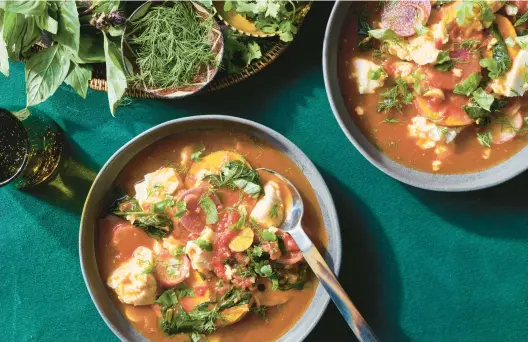  ?? KELLY MARSHALL/THE NEW YORK TIMES PHOTOS ?? Full of lemon grass, tamarind and tofu, this light vegetable soup is a little different each time you make it — and that’s part of the allure.