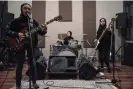  ?? ?? Voice of Baceprot playing in a Jakarta practice room in 2021: from left, guitarist and vocalist Firda Marsya Kurnia, drummer Euis Siti Aisyah and bassist Widi Rahmawati. Photograph: Bay Ismoyo/AFP/Getty Images