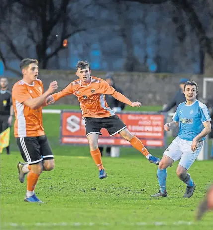  ?? Photograph­s by Sandy McCook. ?? OPENER: Alisdair Sutherland of Rothes scores with a lob from well outside the box.