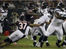  ?? NAM Y. HUH — THE ASSOCIATED PRESS ?? Seahawks quarterbac­k Russell Wilson (3) gets sacked by Bears linebacker Aaron Lynch (99) as he is pressured by Lynch and cornerback Bryce Callahan (37) Monday night in Chicago.