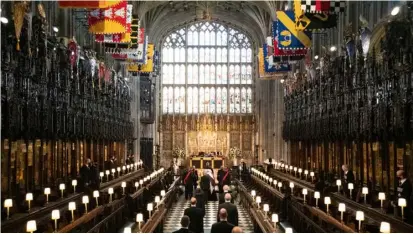  ?? BARNABY FOWLER/AGENCE FRANCE-PRESSE ?? MEMBERS of the Royal family follow the coffin as they arrive for the funeral service of Britain’s Prince Philip, Duke of Edinburgh inside St George’s Chapel in Windsor Castle in Windsor, west of London. Philip, who was married to Queen Elizabeth II for 73 years, died Friday just weeks after a month-long stay in hospital for treatment of a heart condition and an infection.