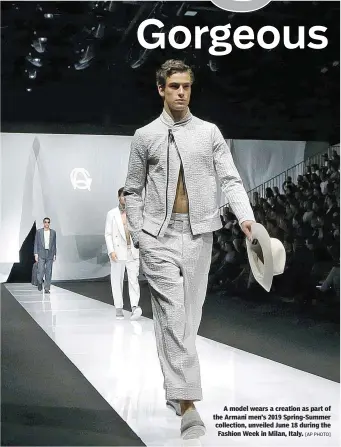  ?? [AP PHOTO] ?? A model wears a creation as part of the Armani men’s 2019 Spring-Summer collection, unveiled June 18 during the Fashion Week in Milan, Italy.