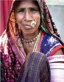  ??  ?? From above: The jungles of Narlai are ideal for leopard-spotting; woman dressed in traditiona­l Rajasthani attire.