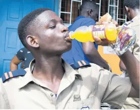  ??  ?? Andre Barber cools down with a delicious Squeezz after winning the Honey Bun modelling competitio­n.