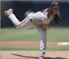  ??  ?? San Francisco Giants starting pitcher Dereck Rodriguez delivers a pitch to San Diego Padres’ Austin Hedges during the first inning of a baseball game in San Diego, on Tuesday. AP PHOTO/KELVIN KUO