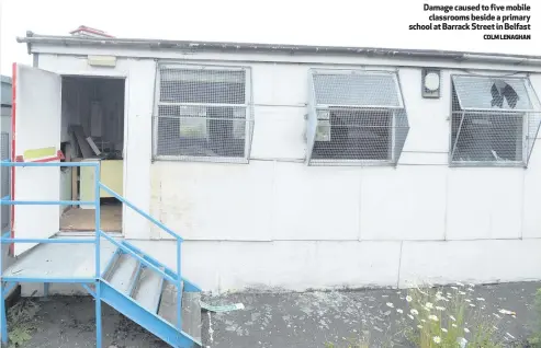  ?? COLM LENAGHAN ?? Damage caused to five mobile
classrooms beside a primary school at Barrack Street in Belfast