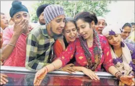  ??  ?? Family members weep as body of slain BSF soldier Gurnam Singh arrives at his village on Sunday. PTI