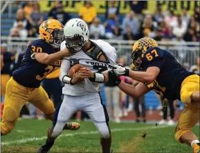  ?? BARRY TAGLIEBER - FOR MEDIANEWS GROUP ?? Pottstown’s Joneil Oister is wrapped up by Pope John Paul II’s Sean Anderson (67) and Steele Depetrillo (30) during Saturday’s game.