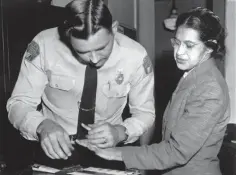  ?? GENE HERRICK THE ASSOCIATED PRESS ?? Rosa Parks is fingerprin­ted by police Lt. D.H. Lackey in Montgomery, Ala., Feb. 22, 1956, two months after refusing to give up her seat on a bus for a white passenger.