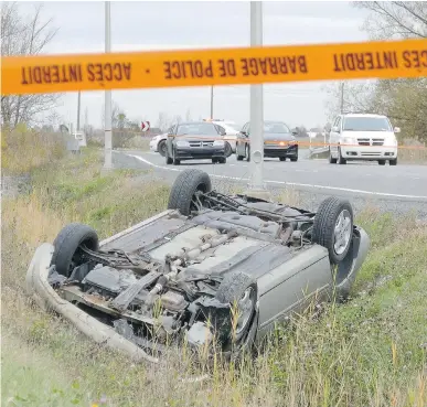  ??  PASCAL MARCHAND/THE CANADIAN PRESS FILES ?? The car that was used to kill Warrant Officer Patrice Vincent in St-Jean-sur-Richelieu, Que., in October lies overturned in the ditch where it ended up after a police chase.