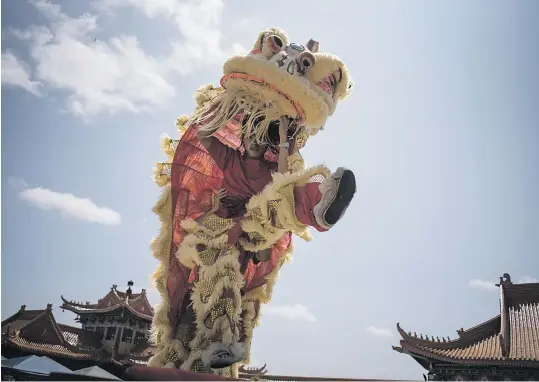 ?? Picture: Jacques Nelles ?? The Lion Dance is seen here as a performanc­e during a Chinese New Year celebratio­n in Bronkhorst­spruit at the Nan Hua Buddhist Temple yesterday.